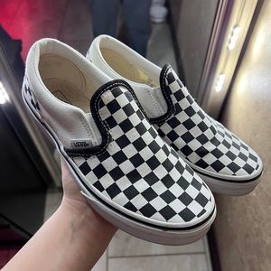 Checkered board slip on vans